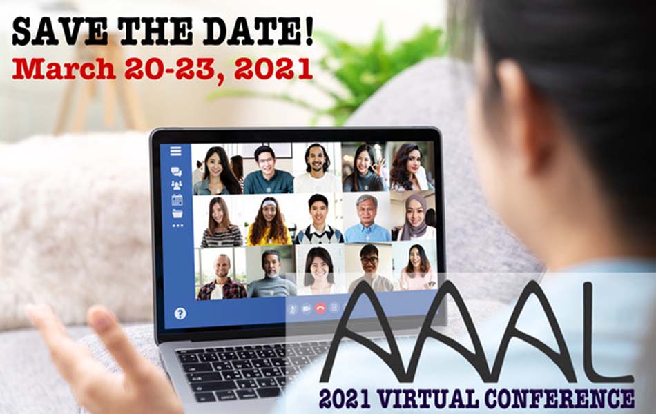 An image of the back of someones head as they speak to a number of people virtually on a laptop