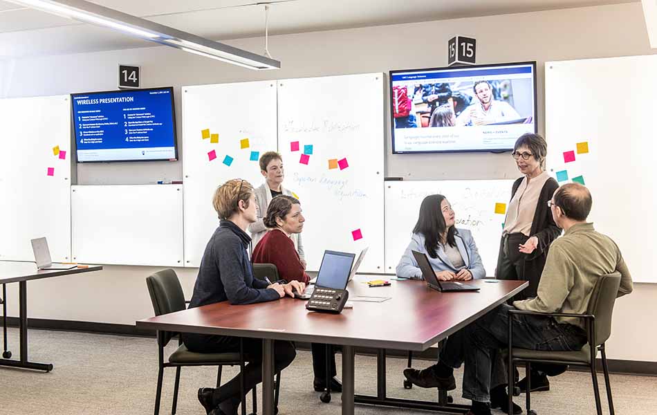 A picture of the SSHRC Partnership Grant group looking at Janet Werker