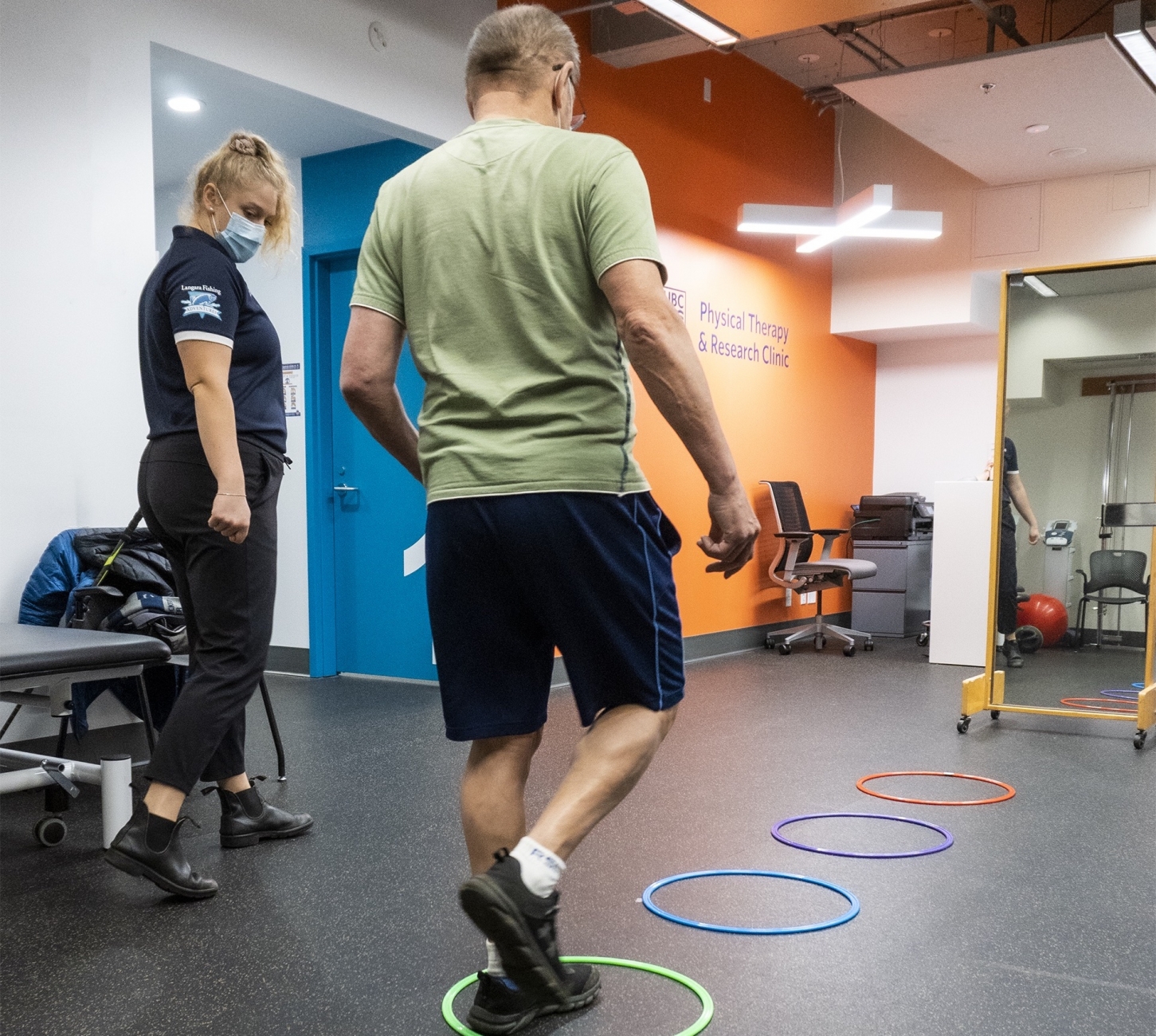 Physical Therapy student helping client with exercises.