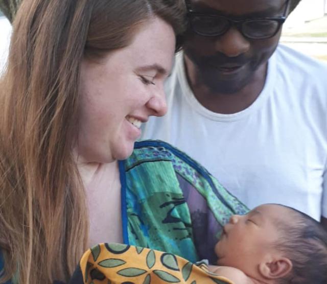 A photo of Monica Shank Lauwo holding her son, Makusaro, with her husband Lauwo