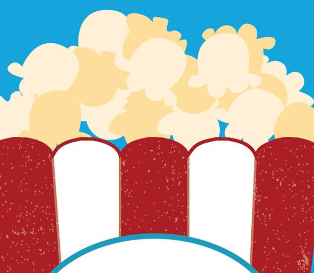 An image of a tub of popcorn against a light blue blackground