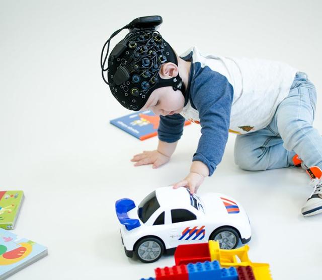 This picture shows a toddler wearing the Brite fNIRS.
