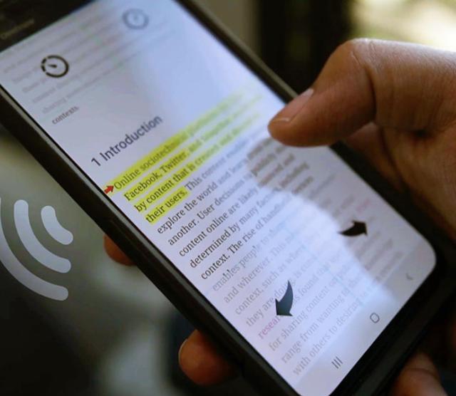 A close up of a hand using the Skimmer app on a mobile phone