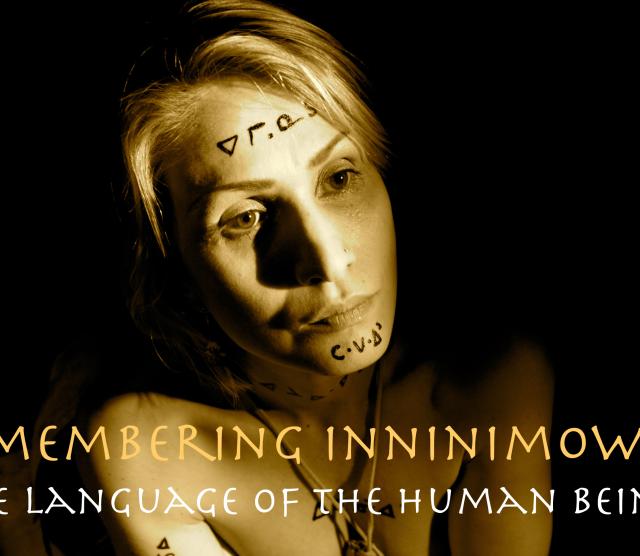 The poster of the film, which features a crouching woman with Cree writing on her forehead