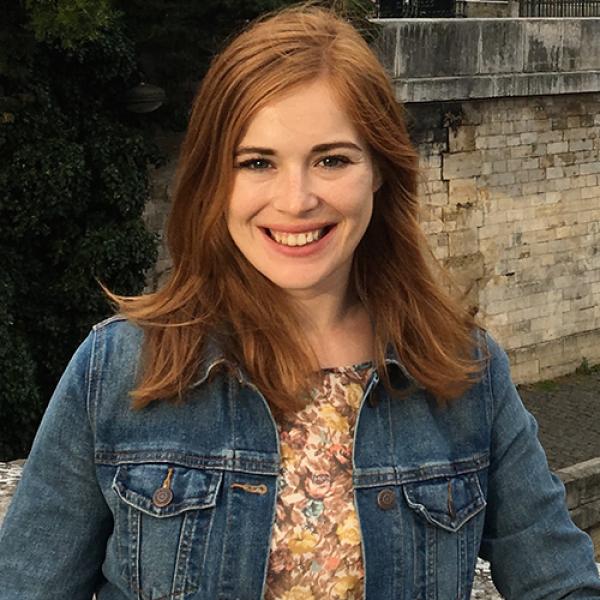 A headshot of Drew Weatherhead standing outside